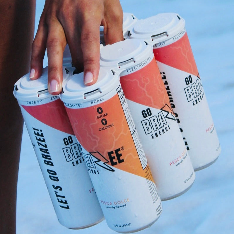Pesca Dolce Go Brazee drink can beside fresh peaches and electrolytes